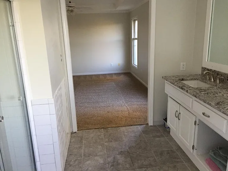 M. bathroom looking in to bedroom