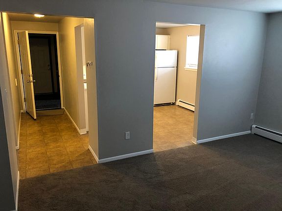 Looking into the kitchen and hall from the living room