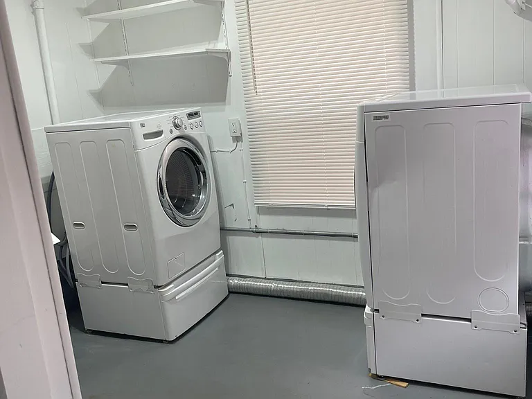 laundry room with washer and dryer
