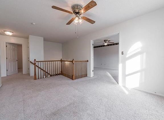 Loft at top of the T stairs has a double door entry into the Master Bedroom