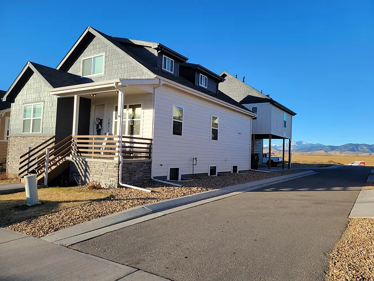 House in front, detached garage in rear