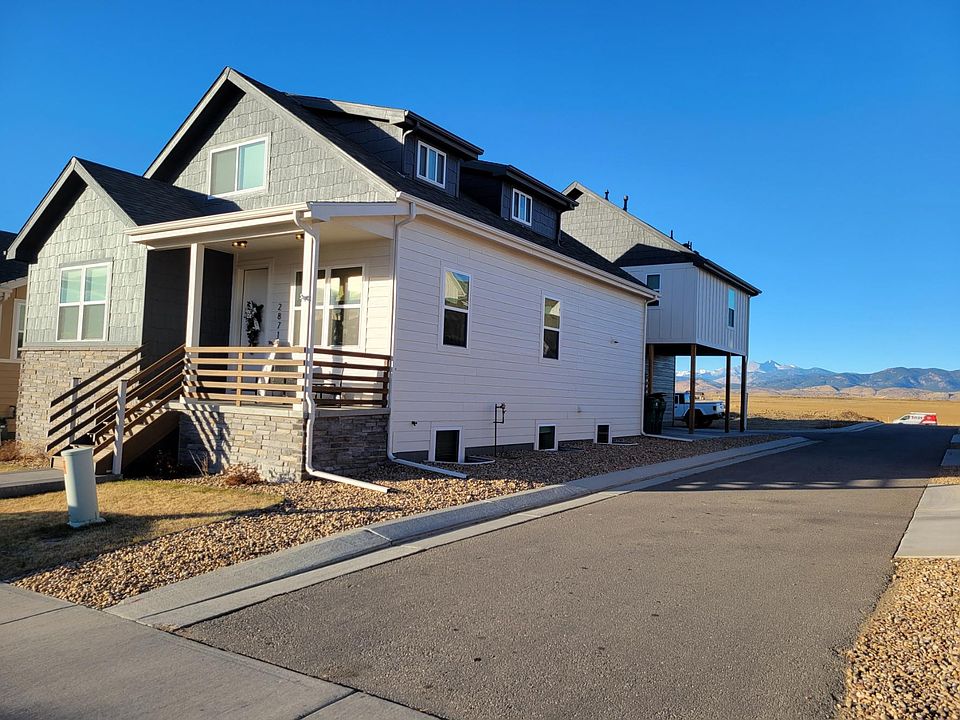 House in front, detached garage in rear