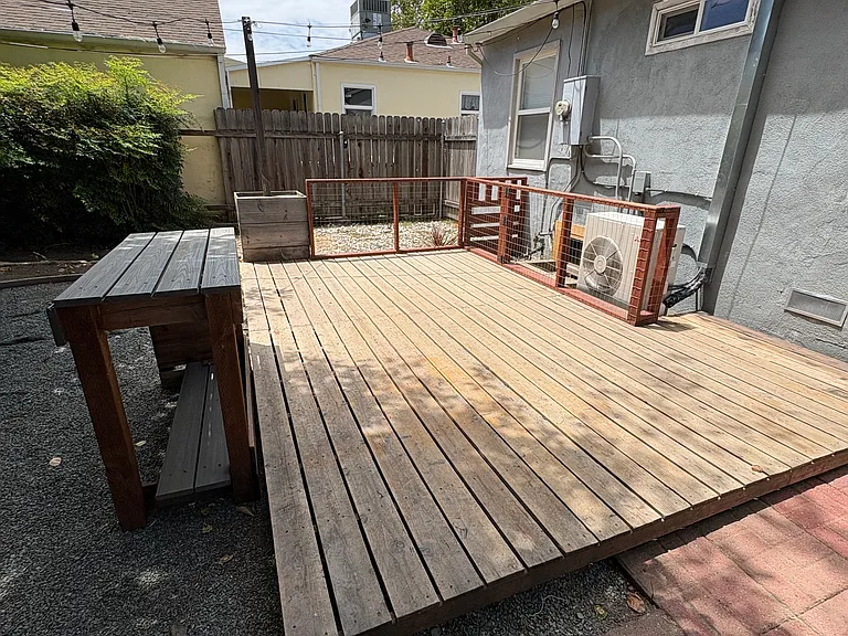 Backyard and deck taken from door to garage