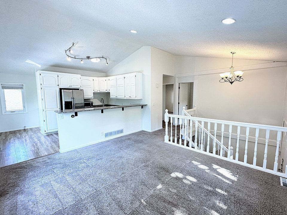 Living room with vaulted ceilings