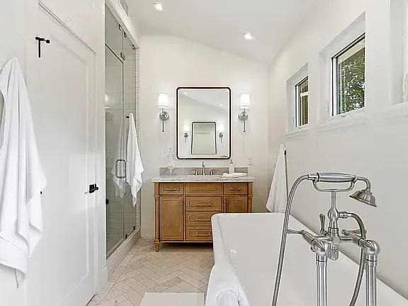 Master Bath Soaker Tub, Dual vanities, European Limestone Herringbone pattern floors