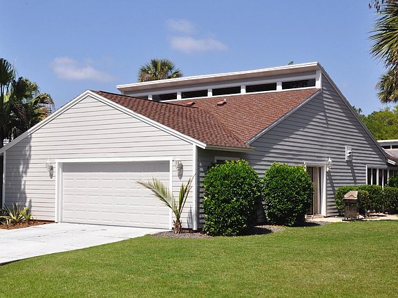 Side Street View - Private Patio w/ Glass Sliding Doors Leading into the Breakfast Nook/Kitchen