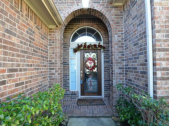 Arched front doorway inviting you inside.