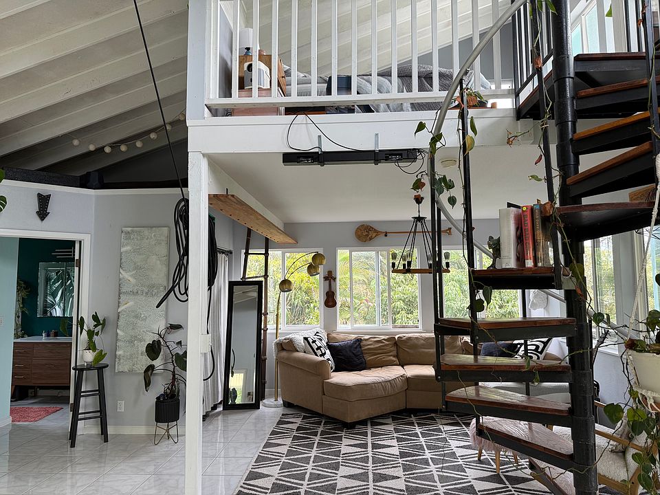 Spiral staircase and lofted second bedroom.