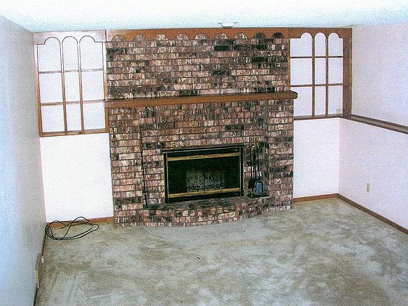 Family room, now has wood pellet stove, porcelain tile being laid spring 2011