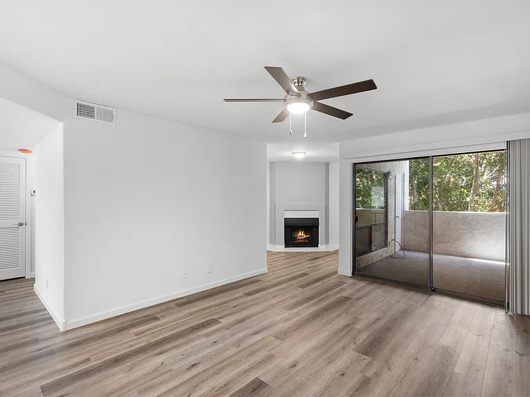 Living Room with attached Den. Access to Private Patio with outside Storage.