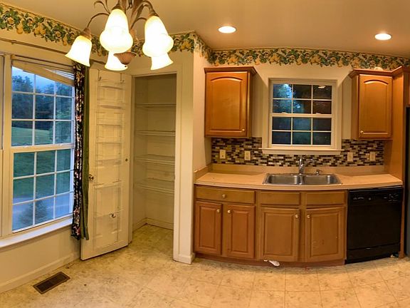 Big open kitchen with a new refrigerator and a pantry