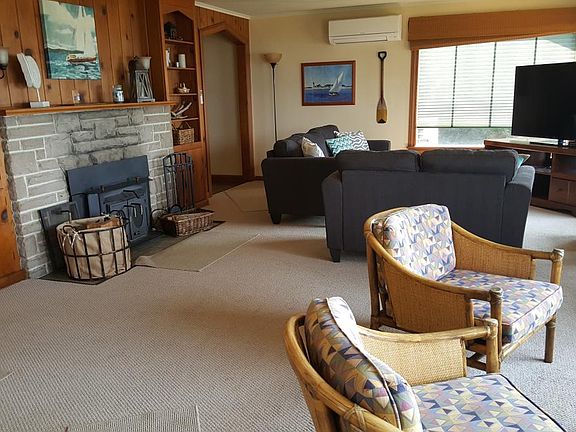 Living room (with 60" screen and fireplace with wood burning