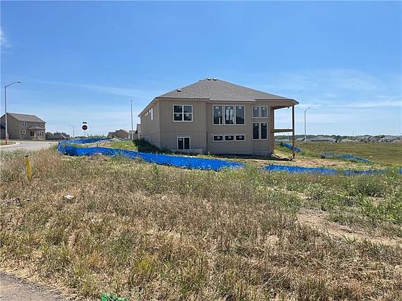Rear elevation p walk out with covered deck and patio