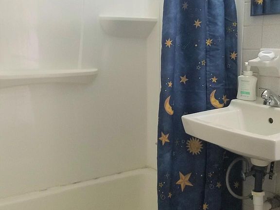Bathroom includes private window and updated shower.