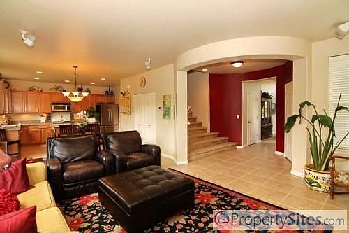 Great room looking at entry way and kitchen