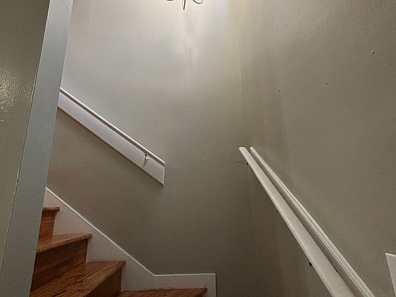 Statement lighting over staircase