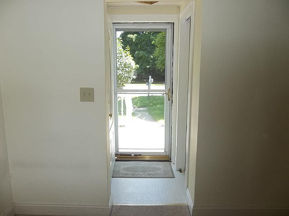 Front entrance with little porch and front yard