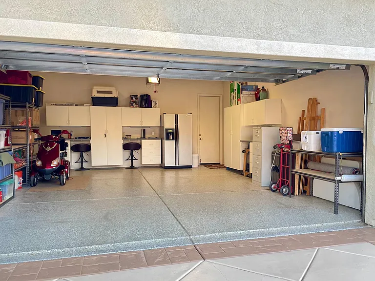 Spacious & insulated two-car garage with convenient extra refrigerator freezer!