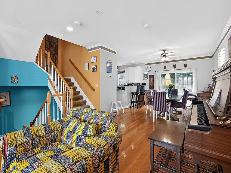 Stairs down to foyer and up to bedrooms