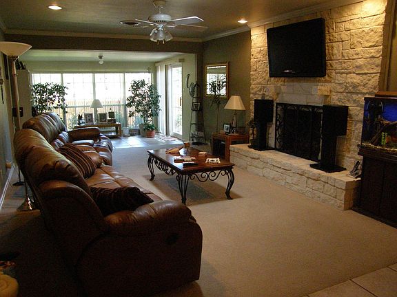 Living Room with Austin stone natural gas fireplace.