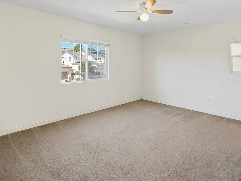 Spare Bedroom 3 Upstairs with Street View, Fan and its own Closet.