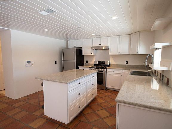 Kitchen with island. Open floor plan with kitchen and living area open