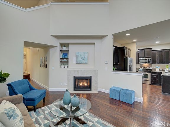 Spacious two-story family rom with a comfy gas log fireplace.