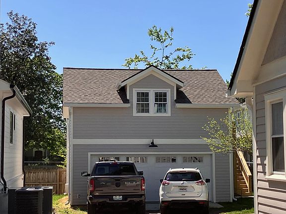 View of front of apartment with steps leading up to right