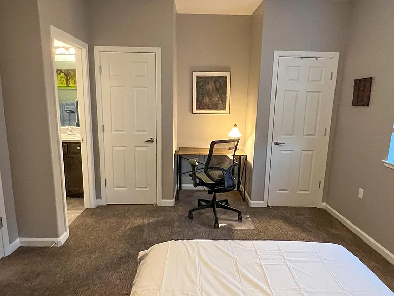 Bedroom2. Desk, two closets and private bathroom.