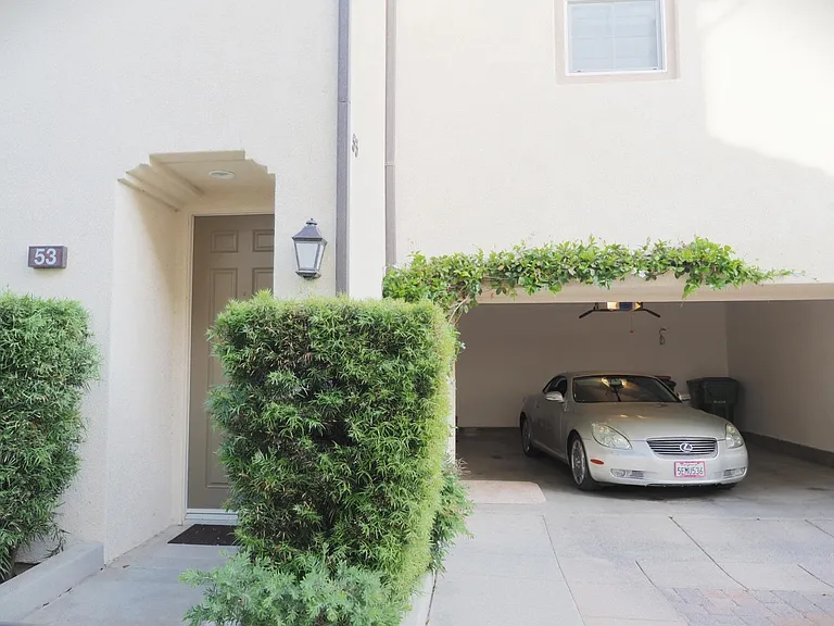 Front door and newly painted 2-car garage