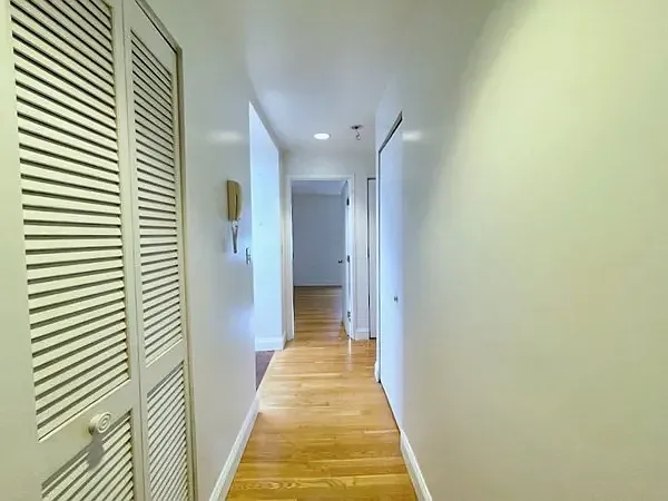 Hallway toward bedroom. Kitchen to the left. Bath to the right.