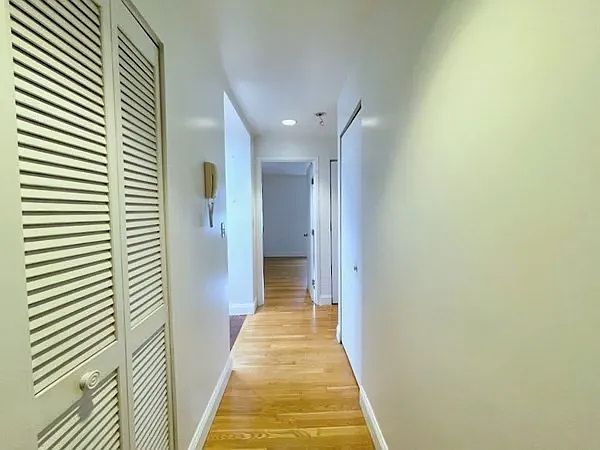 Hallway toward bedroom. Kitchen to the left. Bath to the right.