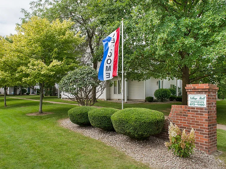 View of Village Walk entrance sign from the corner of Reynolds Road and Dean Spring Drive