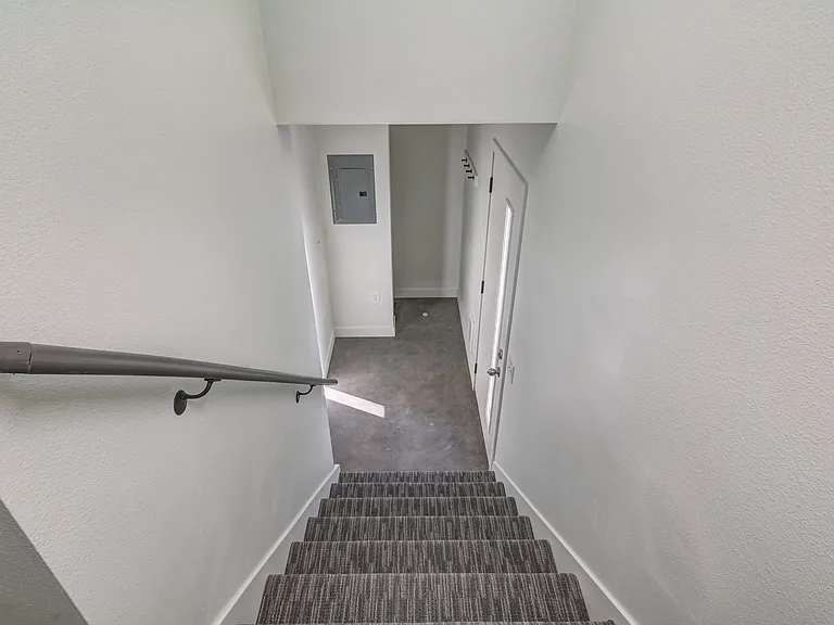 Stairway going up from mudroom, let your dog out back door!