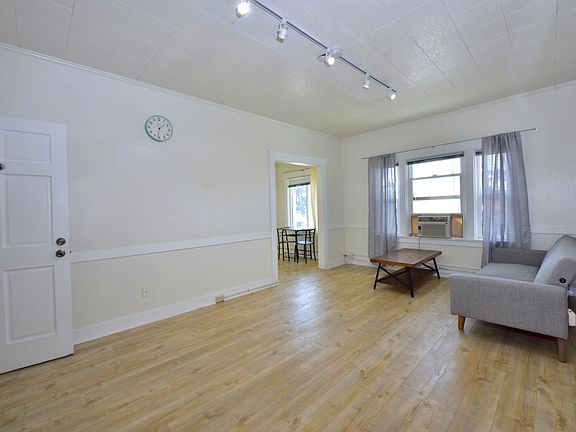 updated LARGE studio with many windows, furnished with in-unit laundry machines
