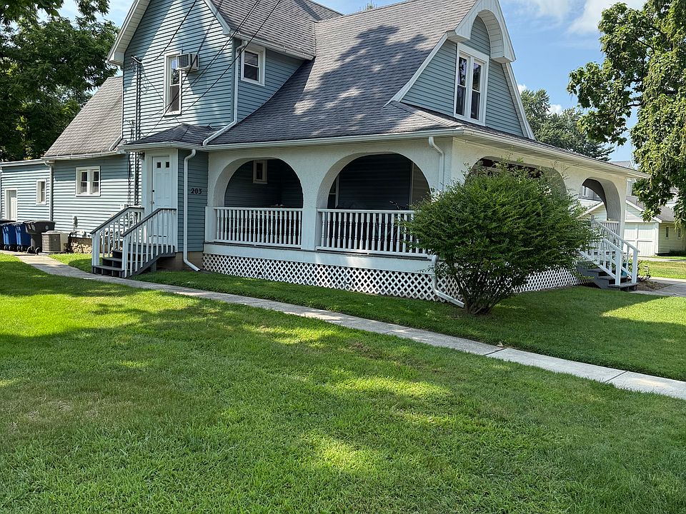 Entry door on the side of this house with interior stairway.