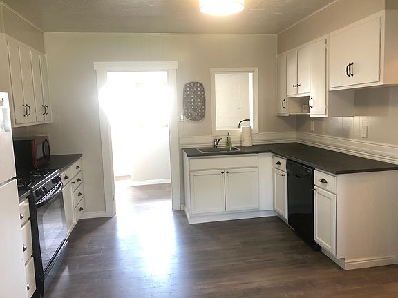 Kitchen. New countertops. New refrigerator. New floors.