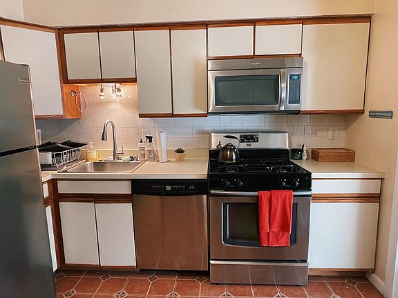 Kitchen - dishwasher, oven, fridge, microwave, garbage disposal, and plenty of cabinet space.