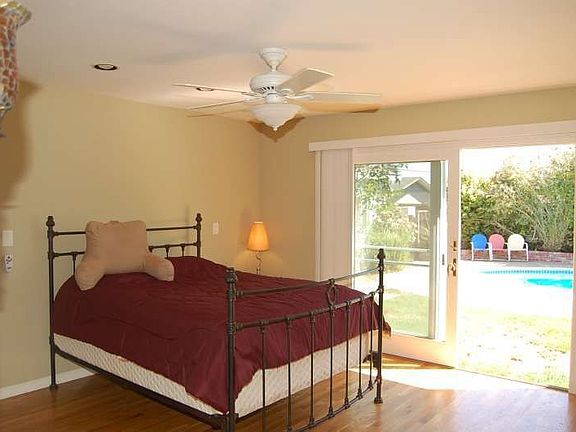 The Spacious Master Bedroom Offer Access to the Backyard and Pool