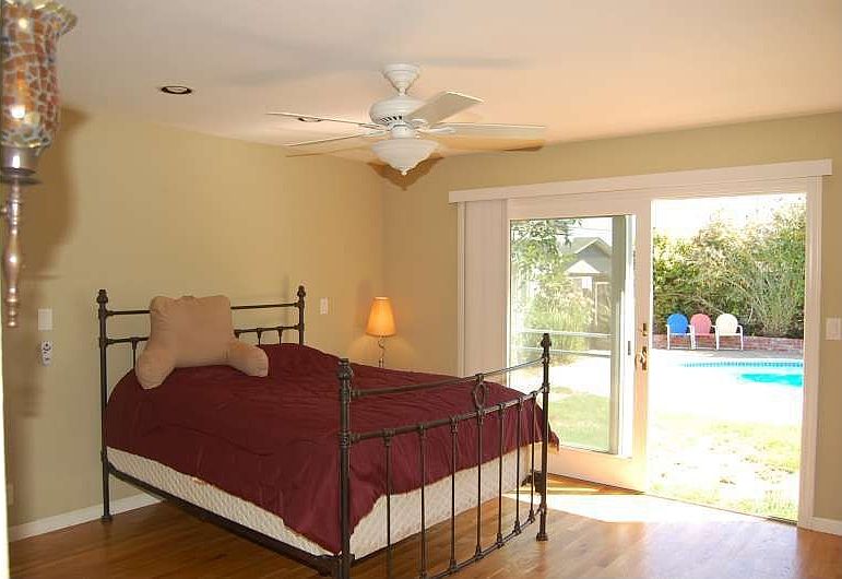 The Spacious Master Bedroom Offer Access to the Backyard and Pool