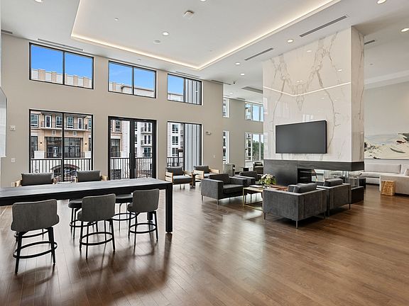 Spacious resident lounge with white marble countertops