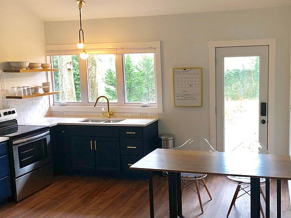 Kitchen and dining area with loads of light.