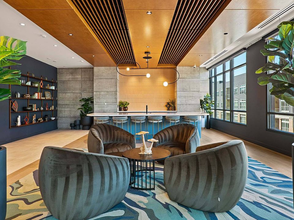 Unwind in a spacious lounge with a cozy sofa and sleek coffee table.