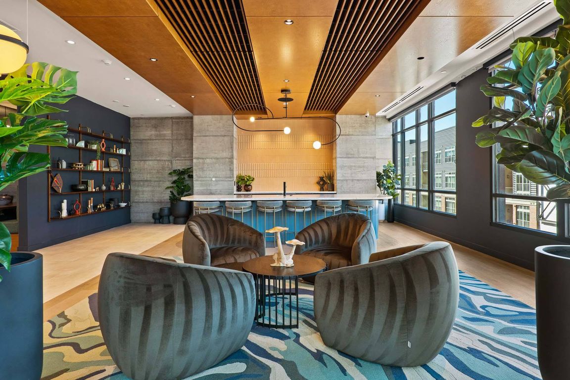 Unwind in a spacious lounge with a cozy sofa and sleek coffee table.