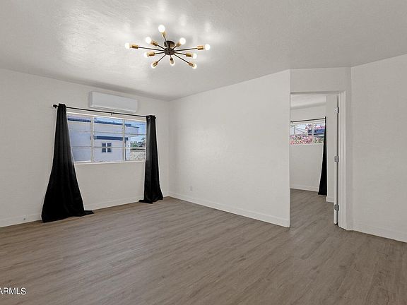 Bright, open living area with stylish LVP flooring _ perfect for relaxing or entertaining.