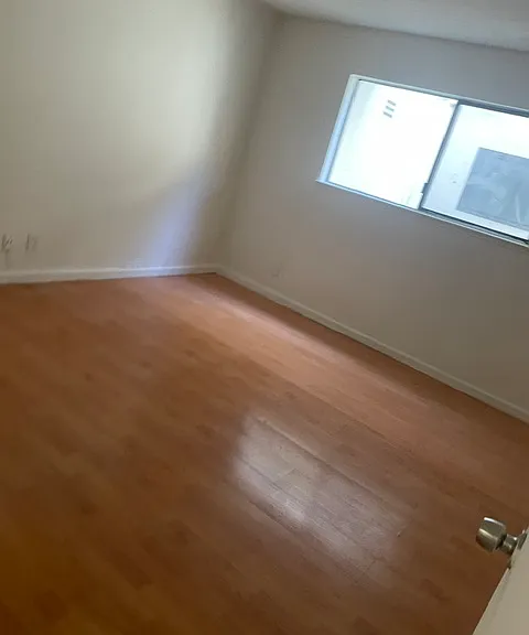Large 13x11 ft bedroom with natural light and walk in closet