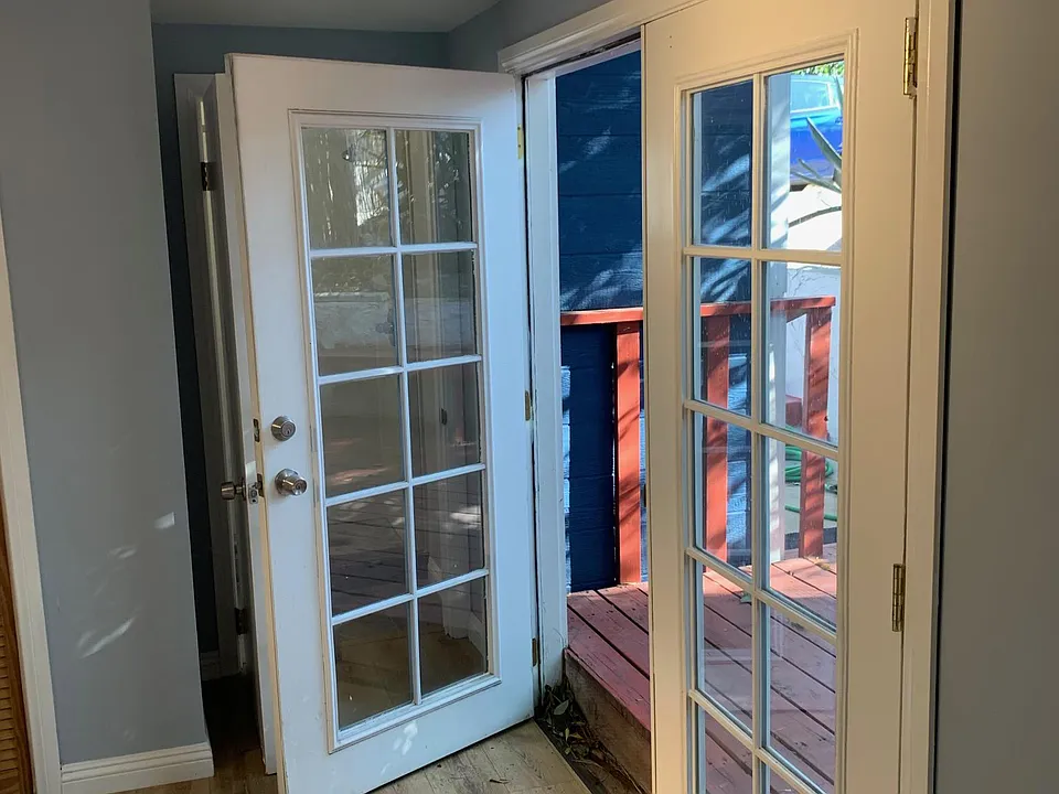 French doors leading from bedroom to private patio