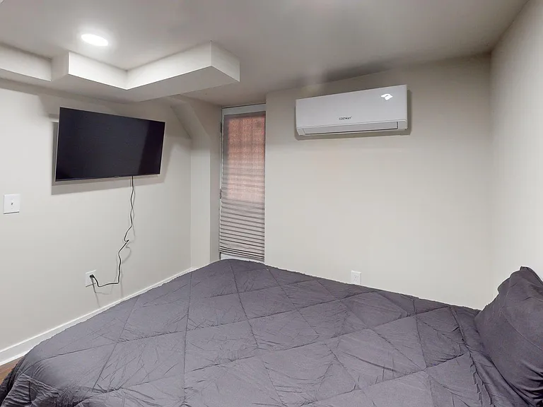 Private entrance, controlled heating and cooling, mounted flatscreen tv.