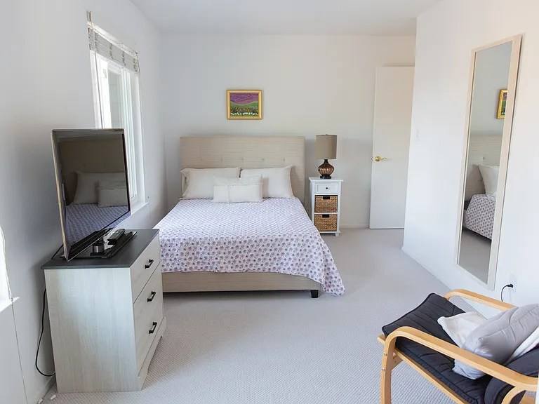 2nd bedroom with full/double bed and full length mirror. Two sets of windows.