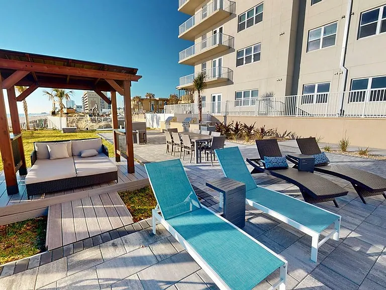 Lounge, dine, and entertain in style with ocean-view seating, shaded cabanas, and a modern outdoor grilling area.